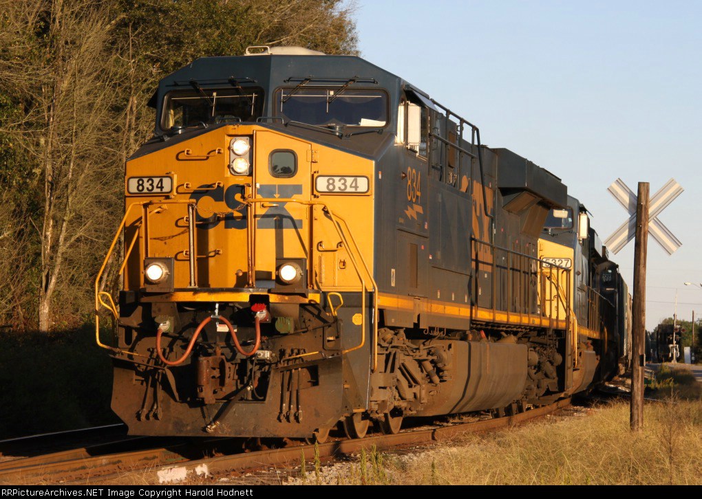 CSX 834 backs into a siding to pick up some cars